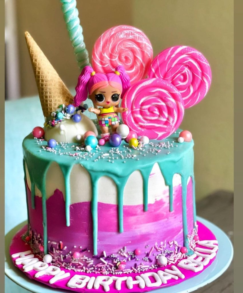 Cake with lollipops and a doll