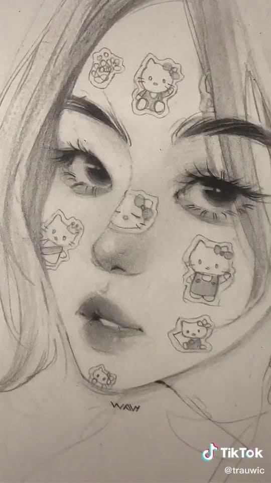 Девушка с наклейками Hello Kitty на лице